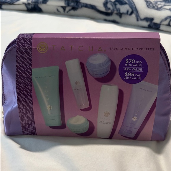 Tatchaminis with cleanser moisturiser etc with purple travel pouch —